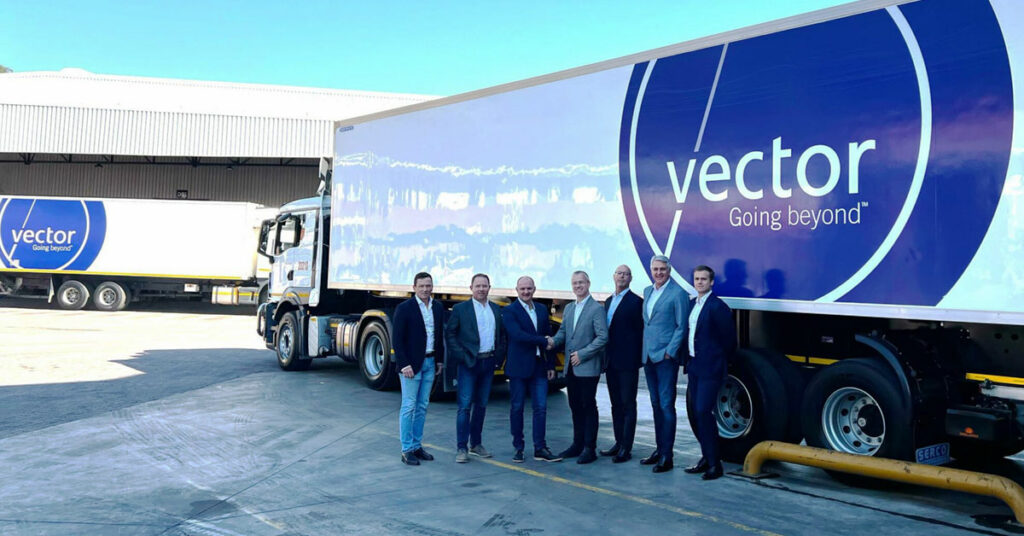 AP Moller acquires Vector Logistics showing business men shaking hands