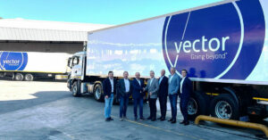 AP Moller acquires Vector Logistics showing business men shaking hands