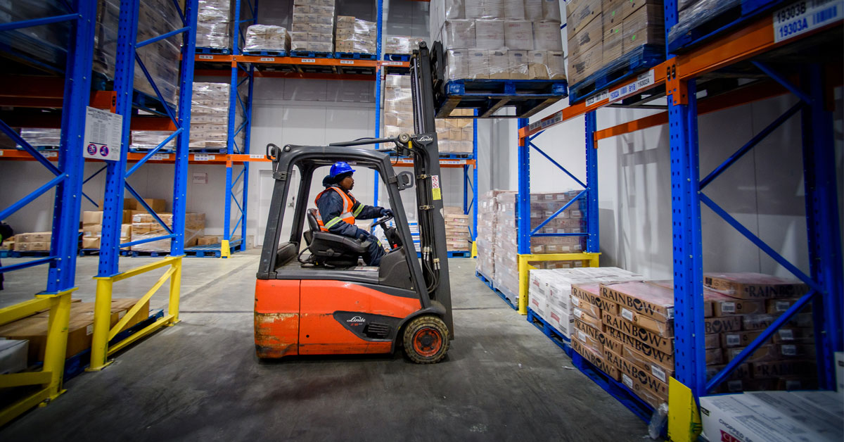 Vector Logistics warehouse showing their bulk and secondary warehouse with a worker in a forklift